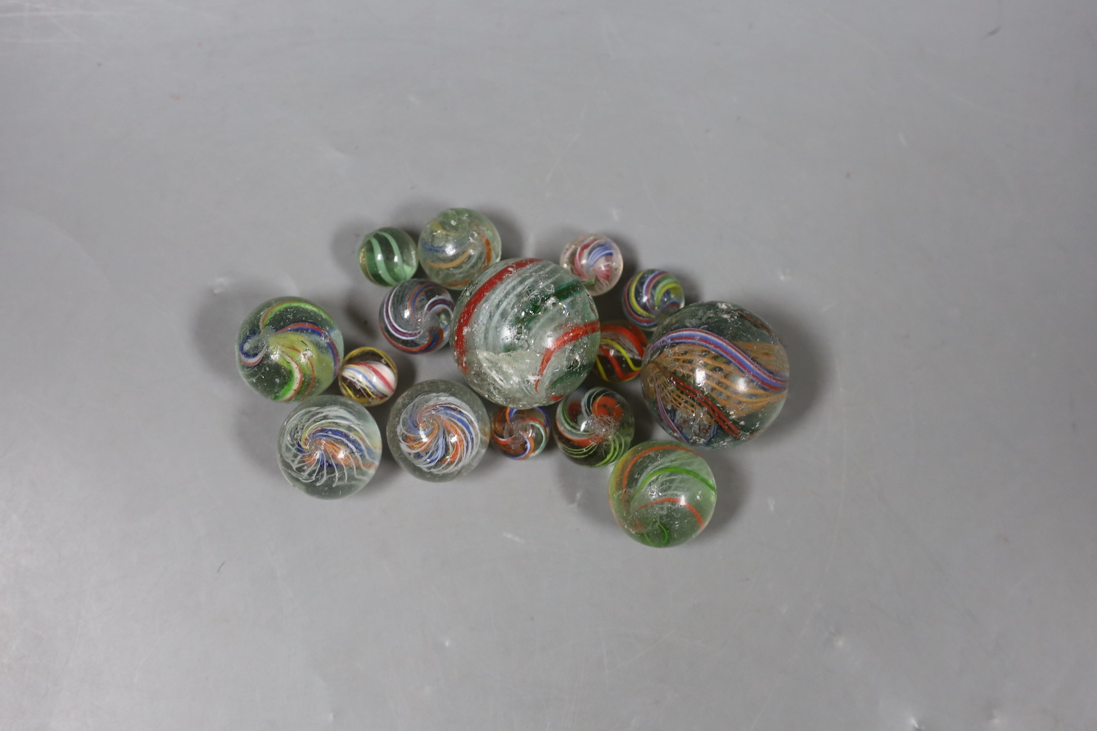 A group of latticino glass marbles